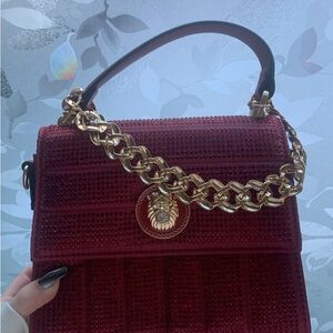 Elegant Red Handbag with Gold Chain